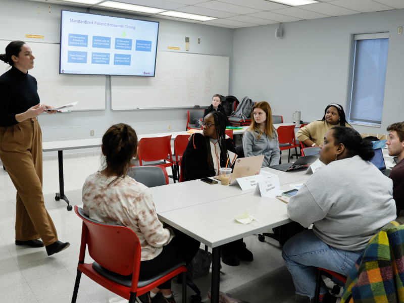 Students learning together about standardized patients