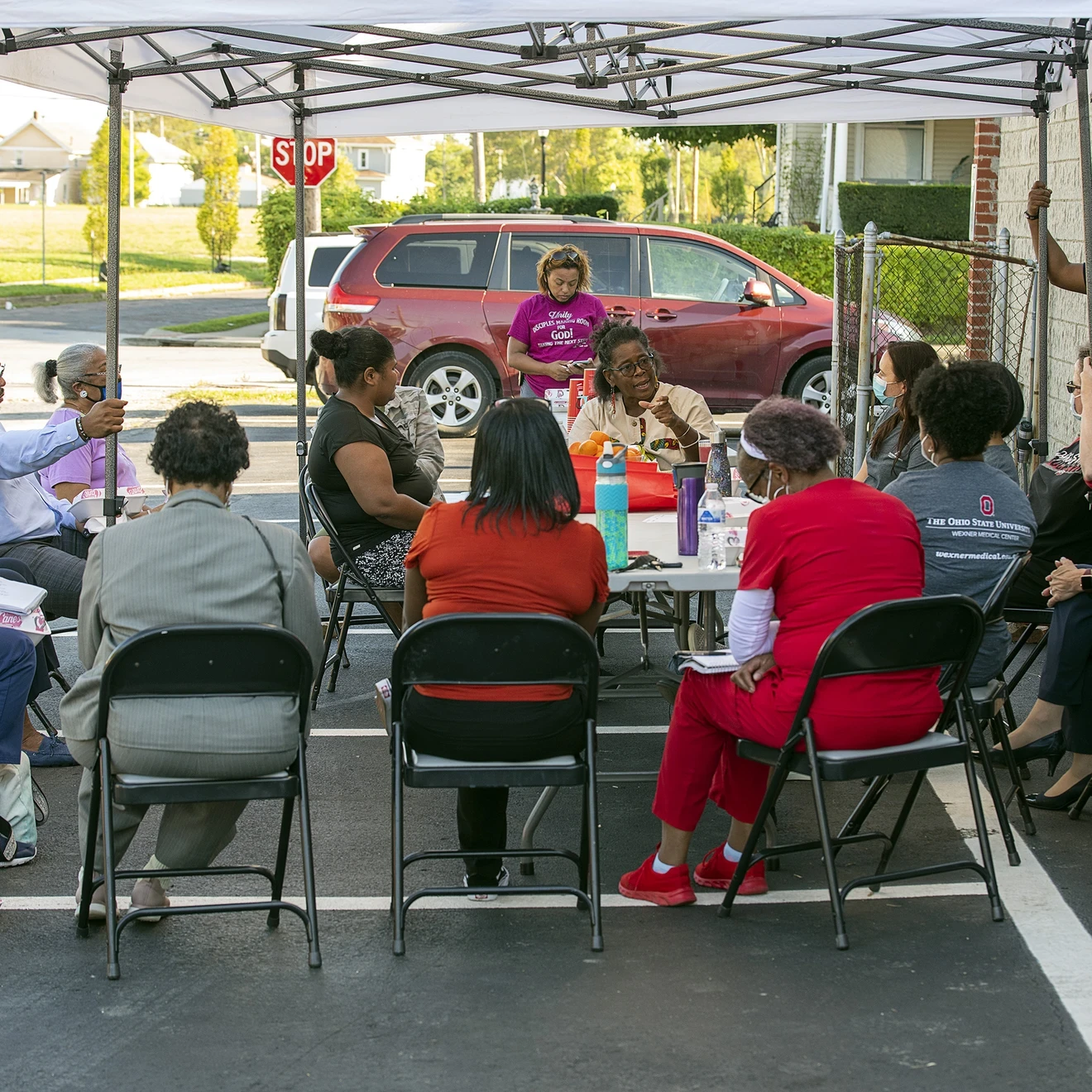 Community members sitting around a table