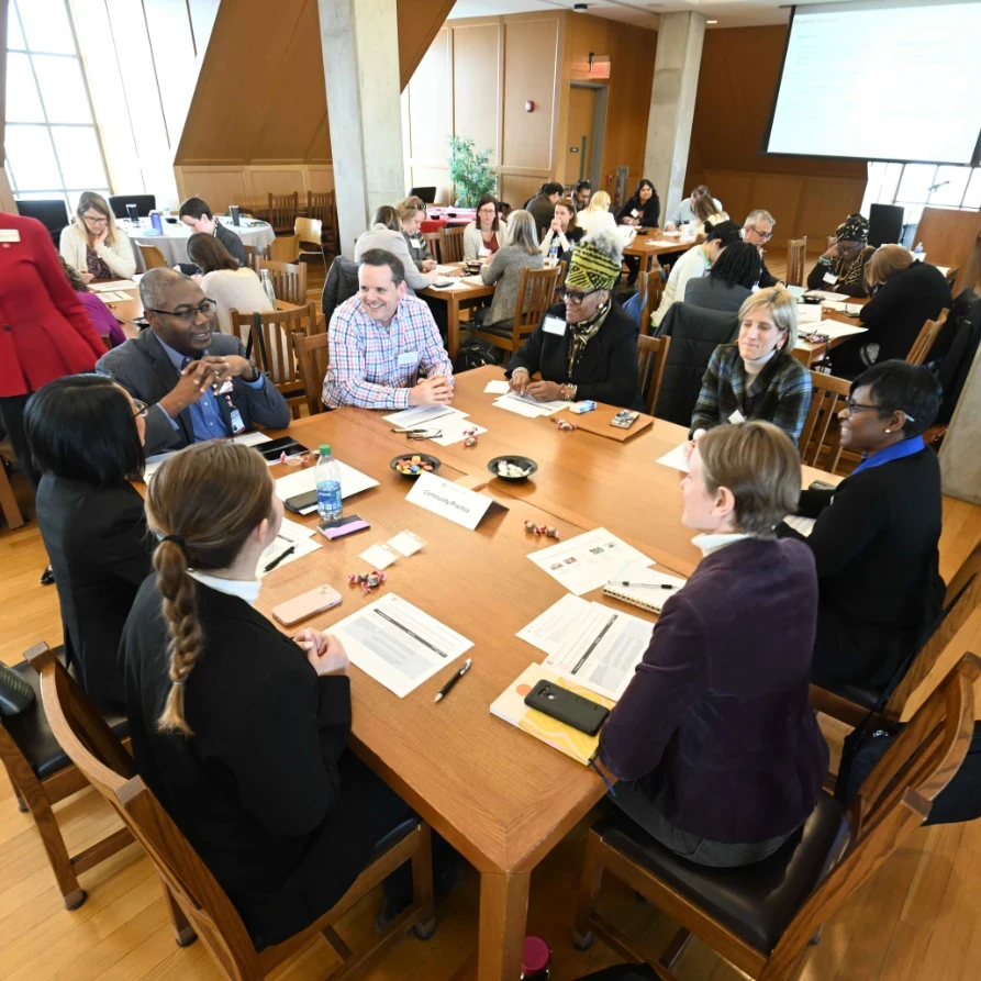 A group of interprofessional colleagues collaborating during a roundtable discussion