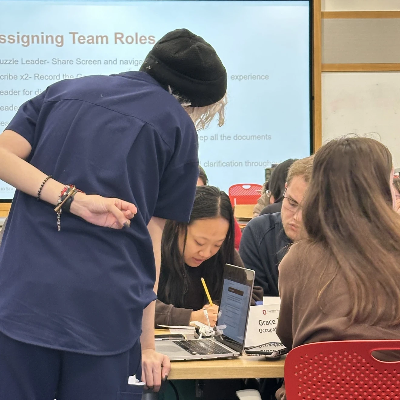 Students learning in a group with an instructor