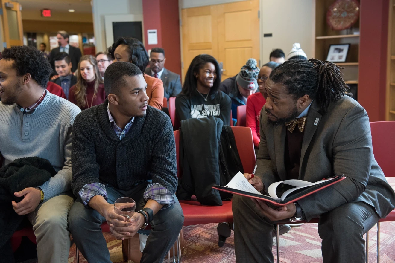 Faculty member talking to a student