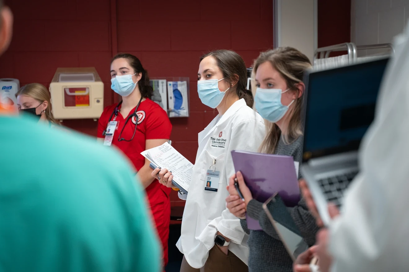 Students from multiple medical fields gathered around at an Eclipse meeting