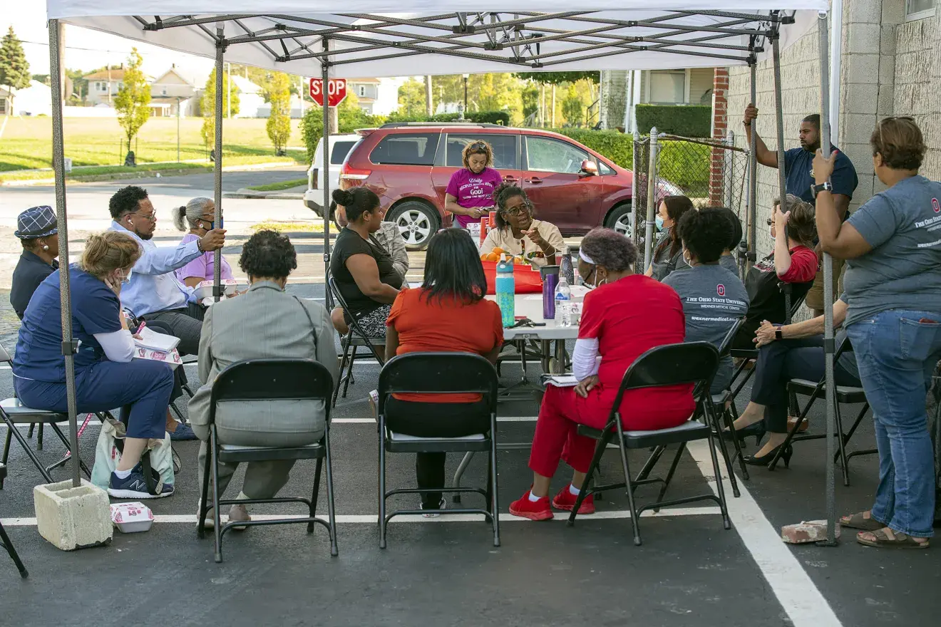 Community Members meeting with members of the IPE team.