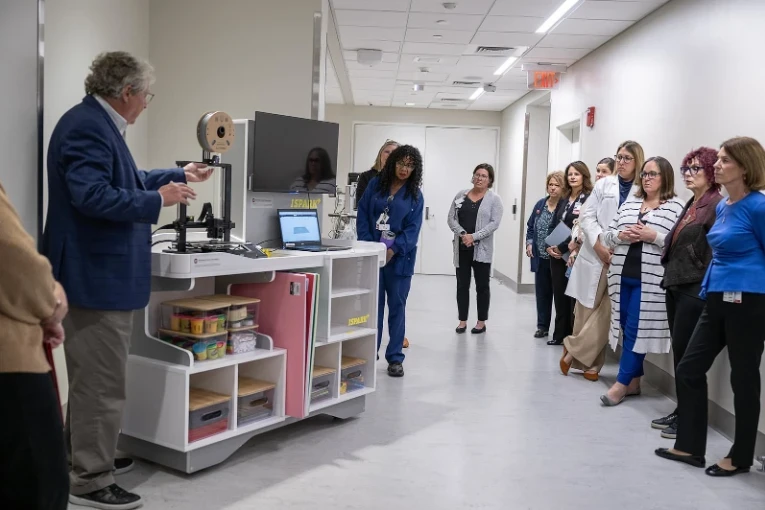 Staff are gathered around the newly launched ISPARK cart