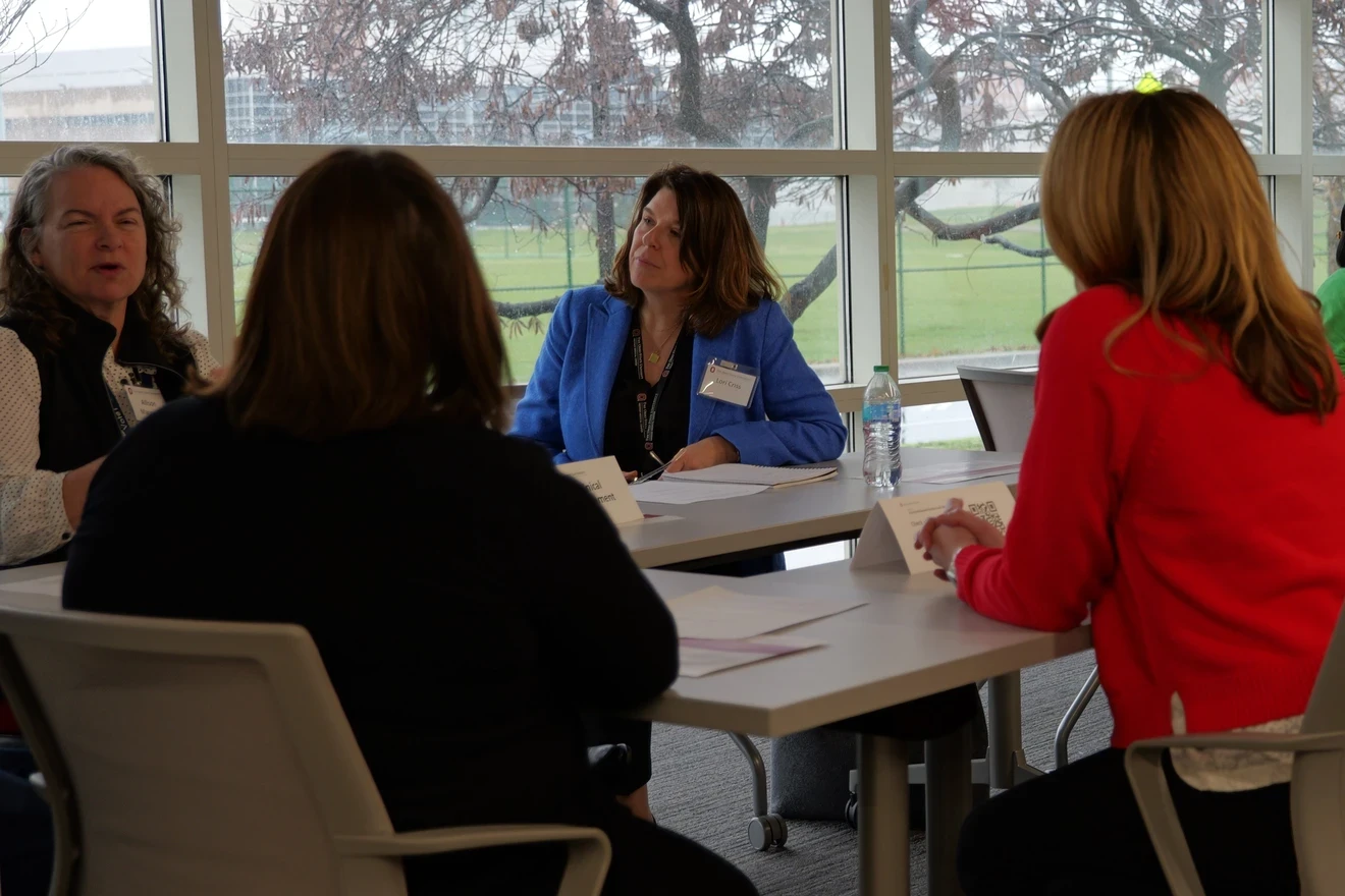 A group of interprofessional colleagues collaborating during a roundtable discussion