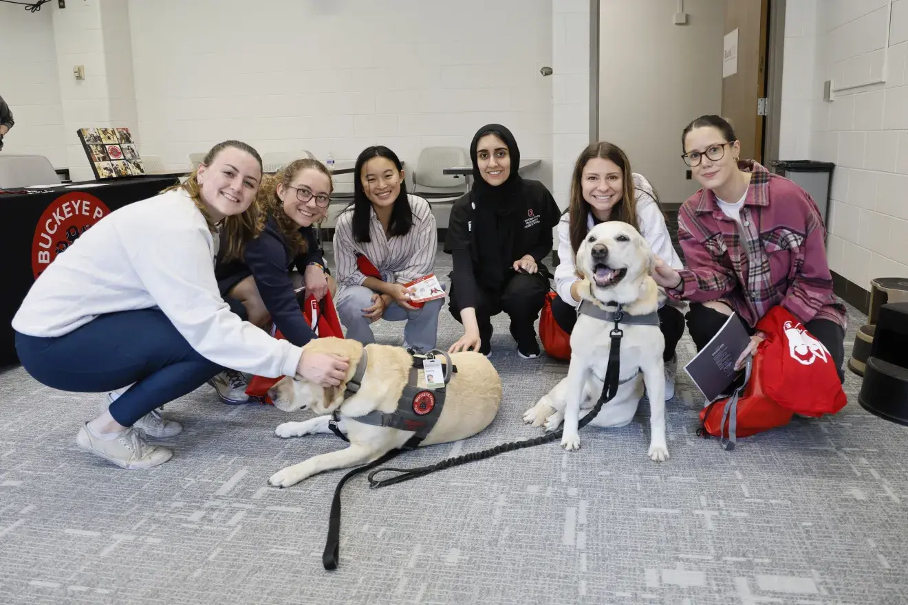 Students with Buckeye Paws therapy dogs