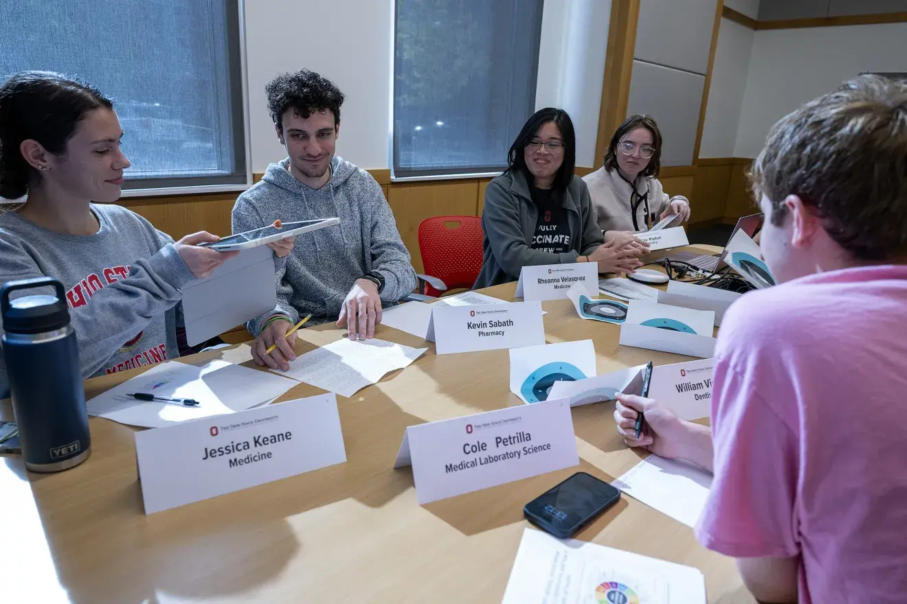 Students learning with each other at a table